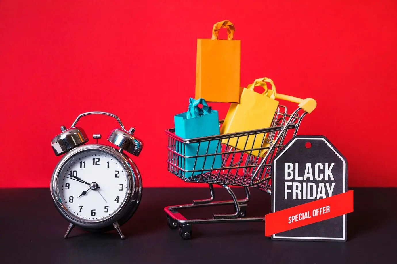 A shopping trolley, small packets, an alarm clock, and a sign.