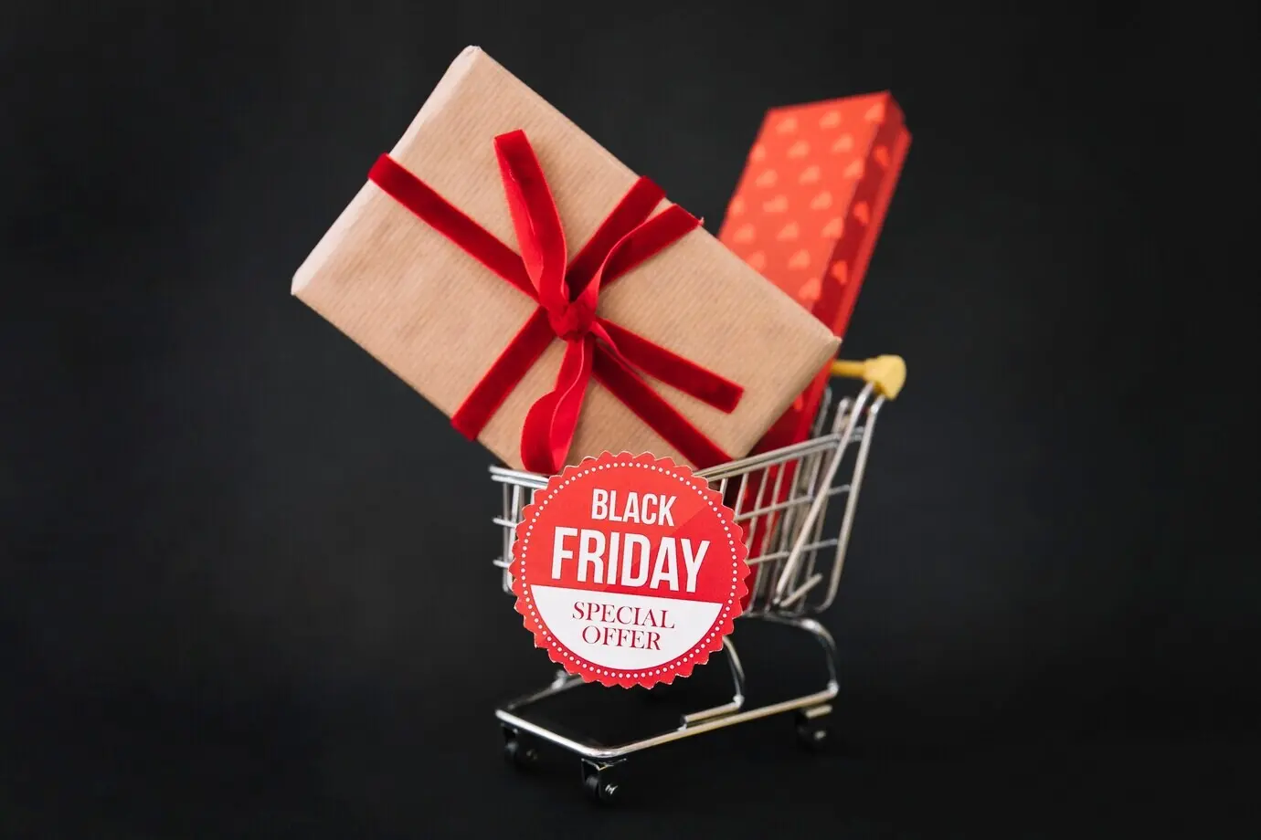 Black Friday decoration featuring gift boxes in a shopping cart